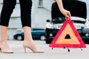 slippery when wet road sign